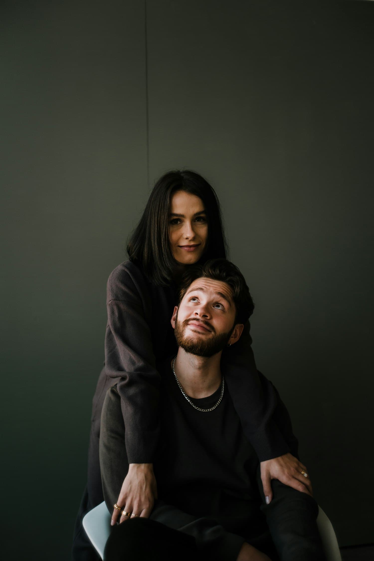 Priya and Marcus in the studio, shot against a dark wall